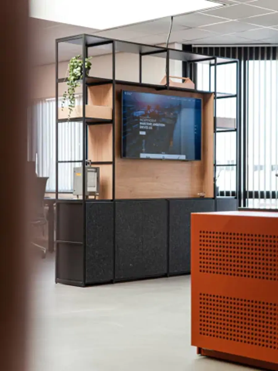 A large flat screen TV is mounted on a wooden stand.