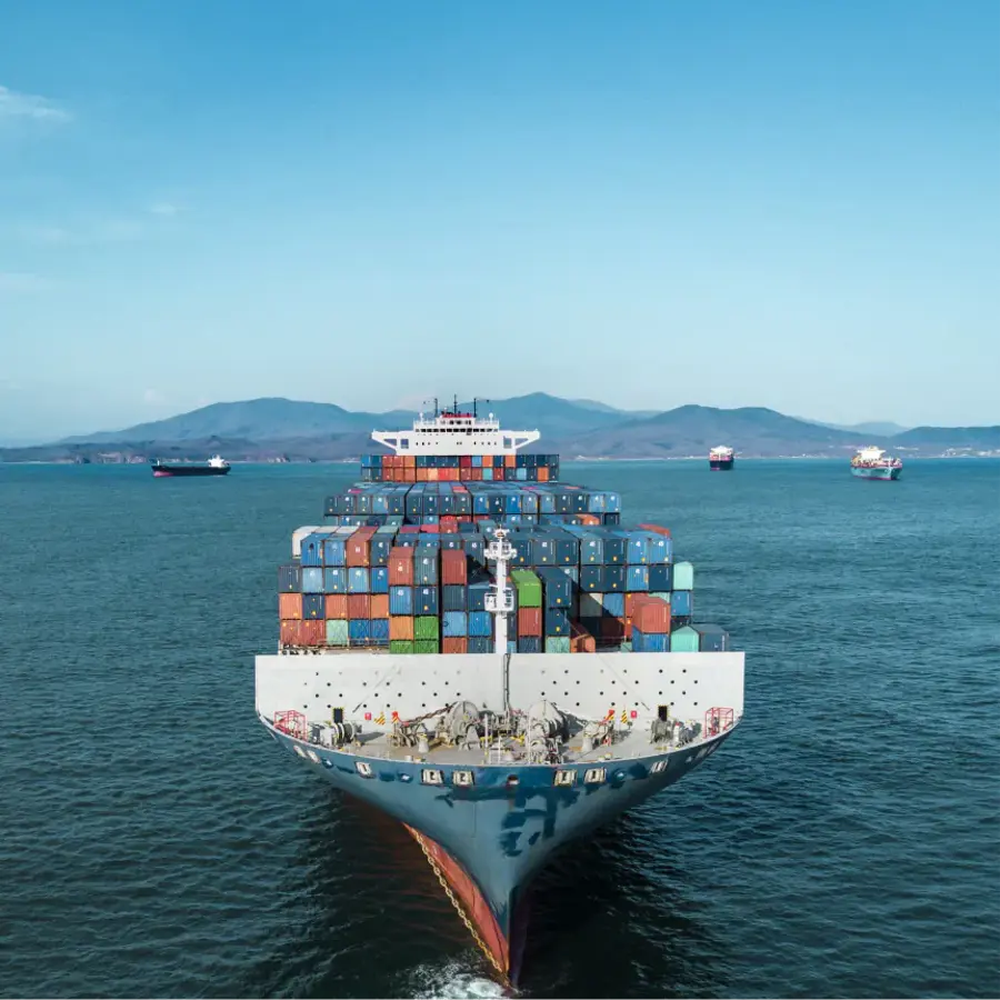 A large cargo ship with a blue hull and a white top.